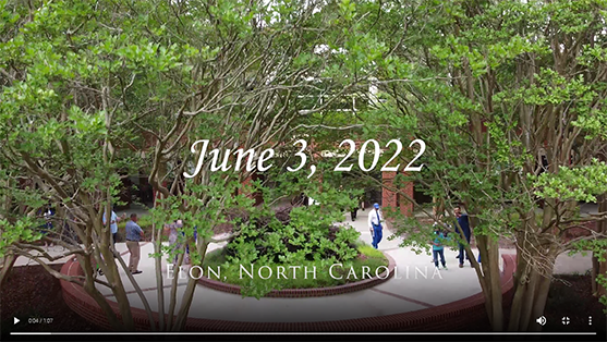 video still of the elon campus with beautiful trees over a courtyard